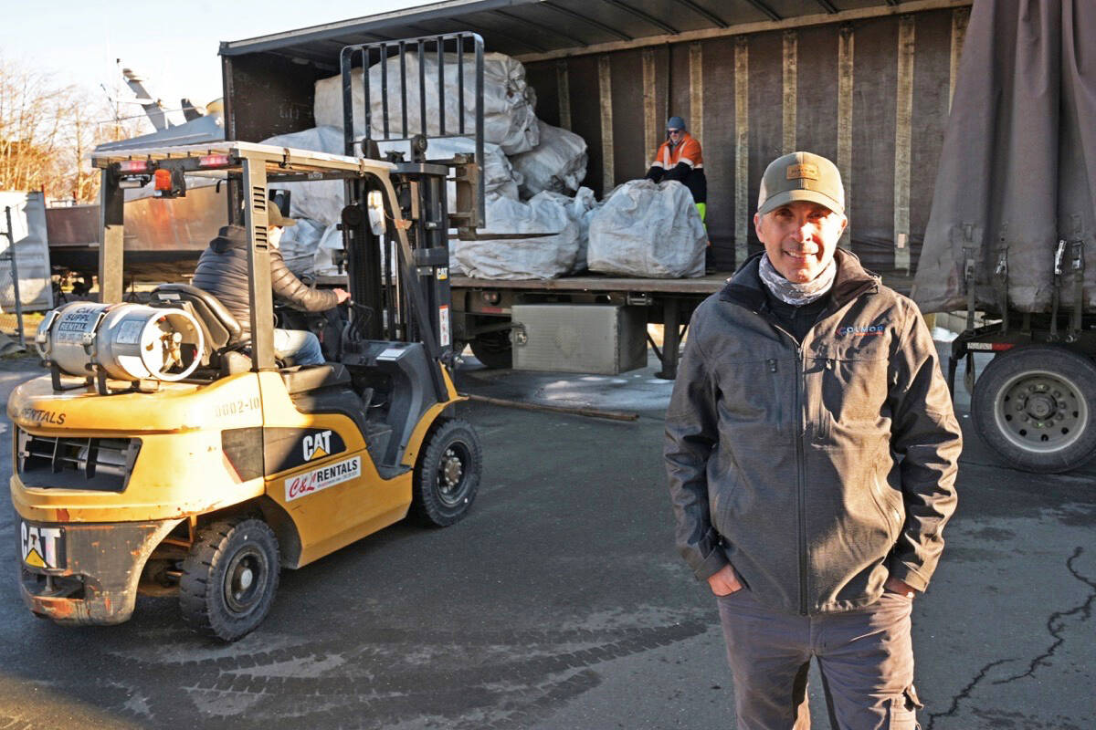 Bill Coltart, president of Campbell River Association of Tour Operators (CRATO), as debris the organization has collected from local shorelines and sorted is loaded onto a transport truck for recycling. Photo by Sean Feagan / Campbell River Mirror.
Bill Coltart, president of Campbell River Association of Tour Operators (CRATO), as debris the organization has collected from local shorelines and then sorted is loaded onto a truck to be transported for recycling. Photo by Sean Feagan / Campbell River Mirror.