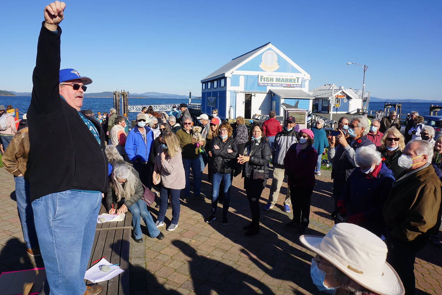 Co-organizer Russell Tripp addresses the crowd during a protest Oct. 30 designed to save Beacon Wharf in Sidney. Days later, council voted unanimously to maintain the wharf for as long as possible without replacing it, sinking a controversial pontoon proposal that would have seen the municipality and the private Marker Group strike a public-private partnership. (Submitted)