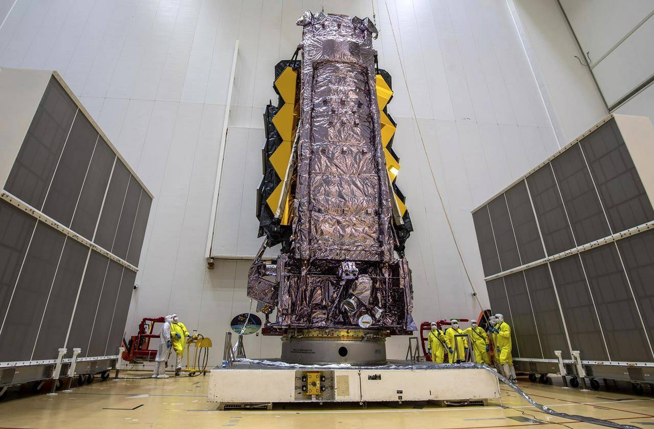 In this Saturday, Dec. 11, 2021 photo released by the European Space Agency, NASA’s James Webb Space Telescope is secured on top of the Ariane 5 rocket that will launch it to space from Europe’s Spaceport in French Guiana. NASA Administrator Bill Nelson confirmed Friday that the James Webb Space Telescope will attempt to blast off on Christmas Eve. A European Ariane rocket will provide the lift from South America’s French Guiana. THE CANADIAN PRESS/AP, ESA - M.Pedoussaut