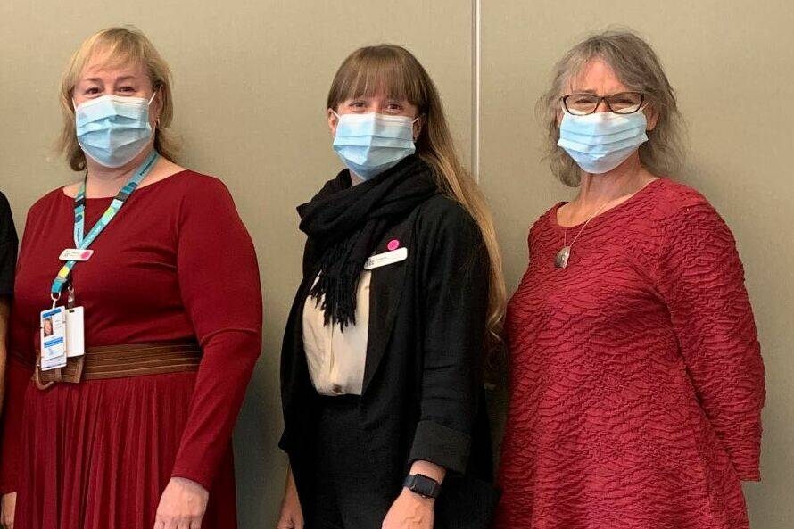 Beth Burton-Krahn (right) stands among her BC Cancer Victoria colleagues. She says the holidays can be especially stressful for her clients impacted by cancer. (Courtesy of BC Cancer)