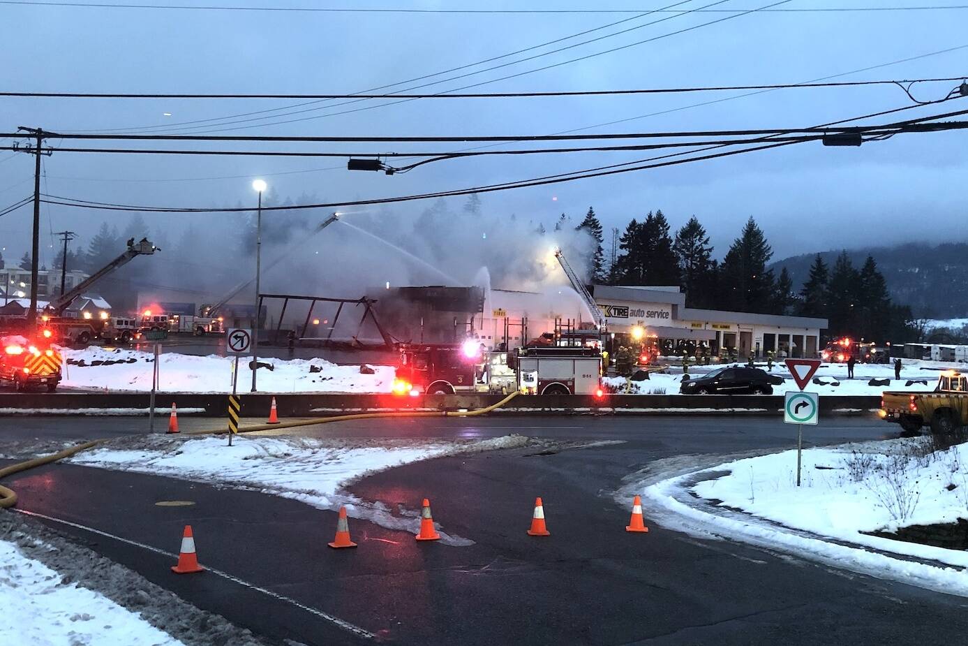 Fire tore into the OK Tire on Norcross Road in North Cowichan early Sunday morning. (Kevin Rothbauer/Citizen)