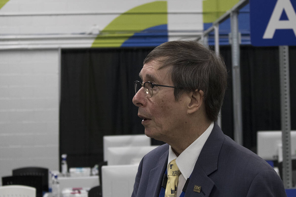 Dr. Richard Stanwick speaks inside the new vaccine clinic at Archie Browning Sports Centre on Jan. 6. His retirement as Island Health chief medical health officer has been delayed by a month in the face of unprecedented COVID-19 cases. (Black Press Media file photo)