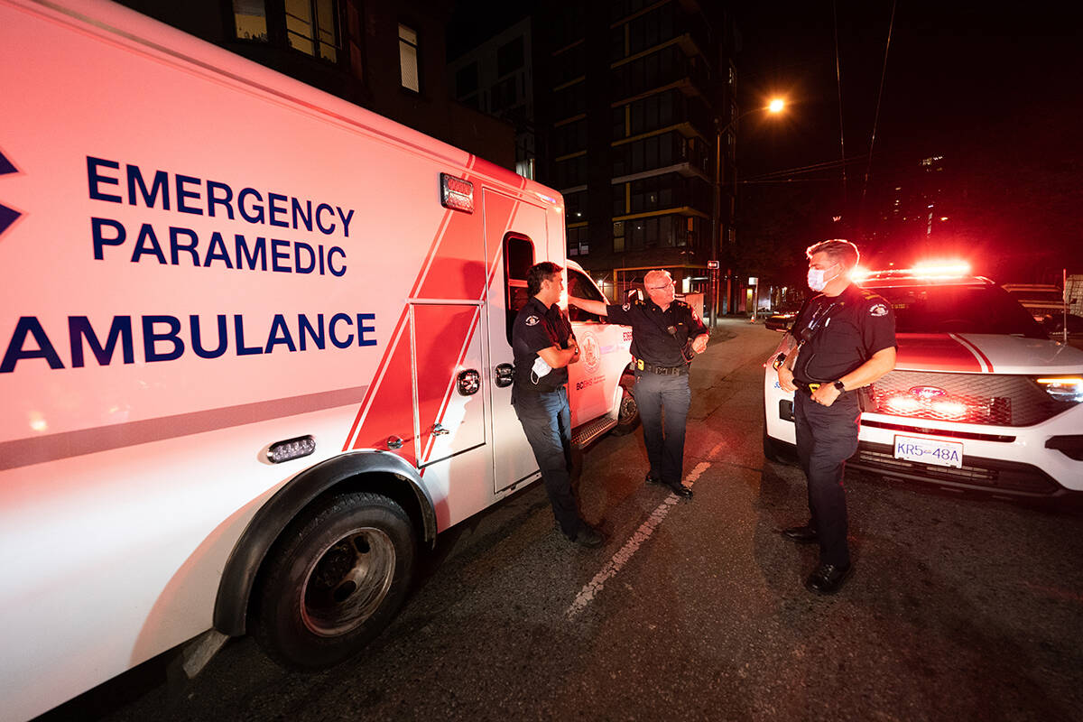 Paramedic specialists Brian Twaites and David Hilder debrief after responding to a drug overdose. Over the past several years the drug overdoses not only across British Columbia but throughout Canada have grown. (Jonathan Hayward - The Canadian Press)