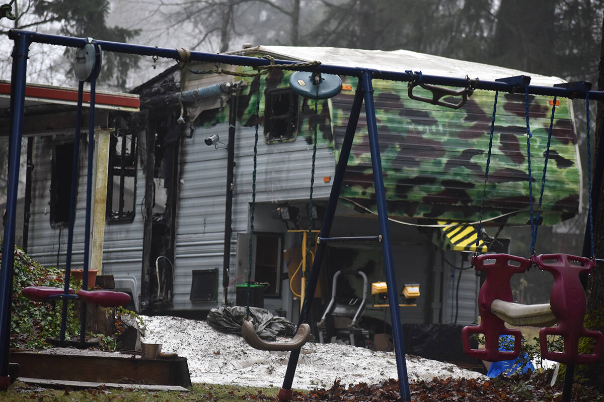 This trailer, situated between two houses on Muir Road, was destroyed by fire Saturday night, Jan. 15. According to eyewitnesses, everyone escaped unharmed. Photo by Terry Farrell
