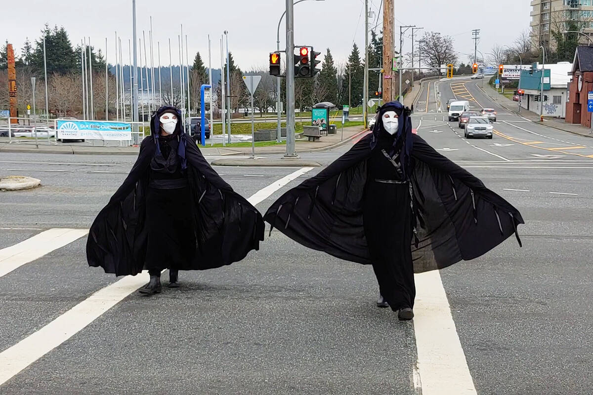 Protesters cross Terminal Avenue at a Save Old Growth protest at the Comox Road intersection Monday, Jan. 17. (Chris Bush/News Bulletin)