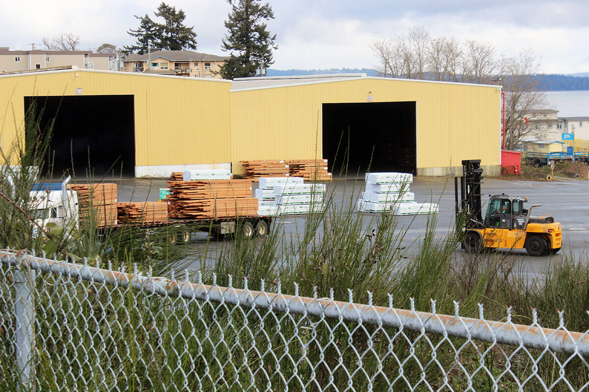 A forklift driver loads a truck in the yard of the Western Forest Products Chemainus sawmill. (File photo by Don Bodger)