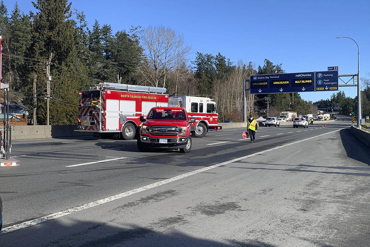 Emergency crews block off a section of the Pat Bay Highway Jan. 31 where a pedestrian was struck by a vehicle. The person, a man in his 50s, died on scene. (Wolfgang Depner/ News Staff)