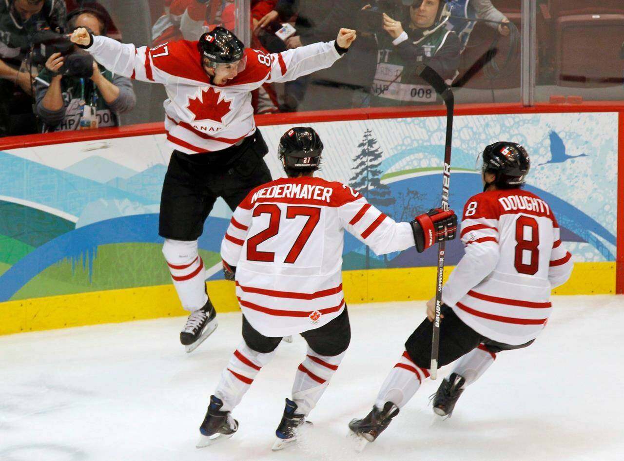 Canada’s Sidney Crosby celebrates his game-winning goal with Scott Niedermayer and Drew Doughty during overtime period men’s ice hockey gold medal final at the 2010 Winter Olympic Games in Vancouver on February 28, 2010.The NHL has officially announced that its players won’t be going to the 2022 Beijing Olympics.THE CANADIAN PRESS/Paul Chiasson
