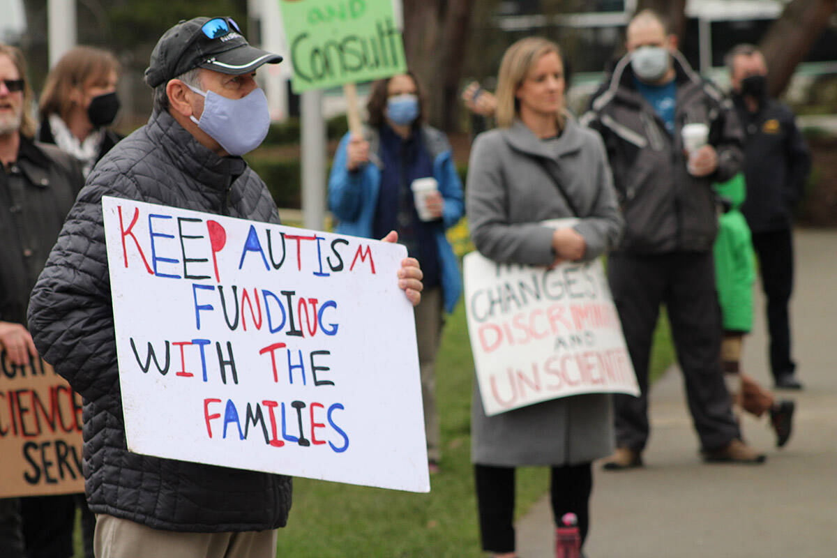 B.C. moving to a community hub model for those with autism and other support needs will cost $172 million over three years. Participants at an event outside the B.C. legislature on Feb. 9 that called for the province to end its planned phase-out of individualized autism funding. (Jake Romphf/News Staff)
