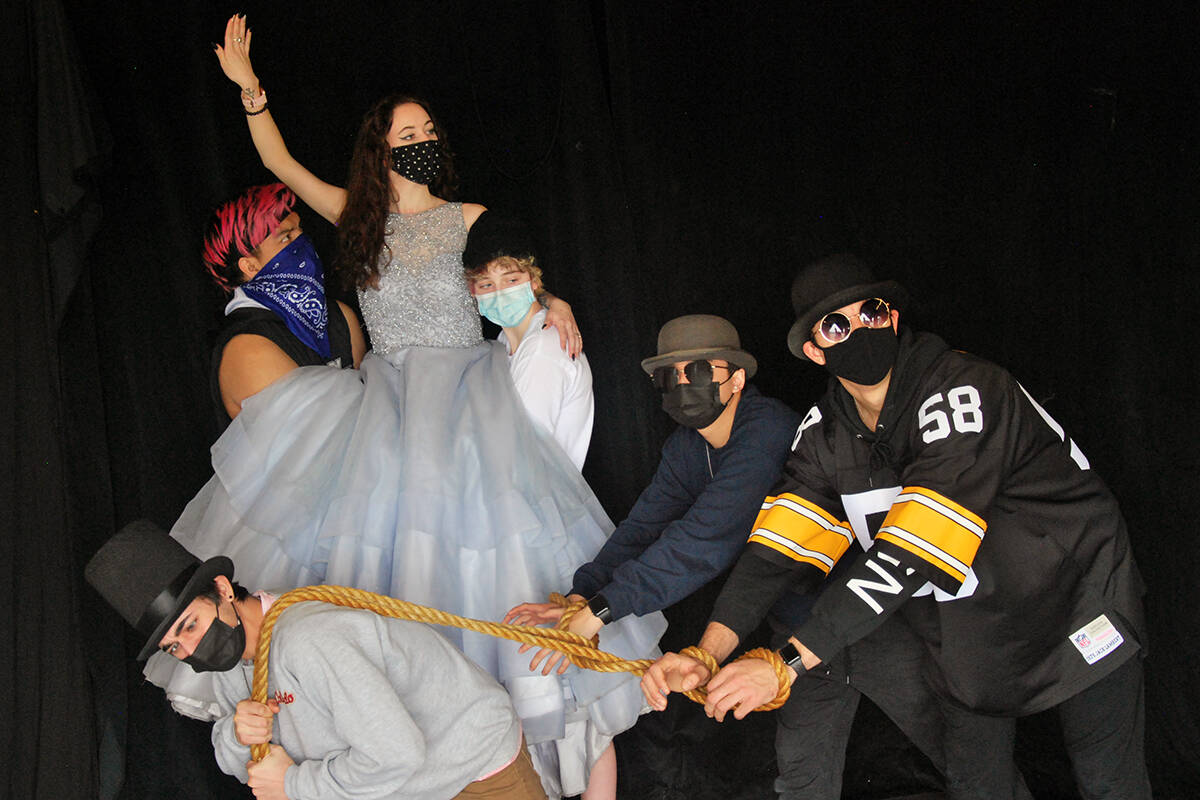 Billionaire Claire Zachanassian, played by Emily Dunigan (top), parades through town with her entourage - Daleal Monjazeb, Charlie Lincoln, Emma St. Laurent, Cameron Le and Curtis Magas (from left) - during rehearsals for the upcoming VIU theatre production, ‘The Visitor.’ (Josef Jacobson/News Bulletin)