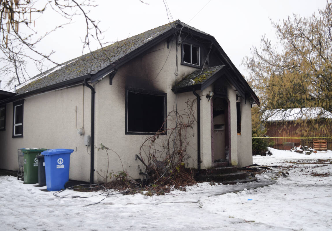 A house on Ian Avenue in Port Alberni caught fire on Feb. 28, 2022. (ELENA RARDON / ALBERNI VALLEY NEWS)