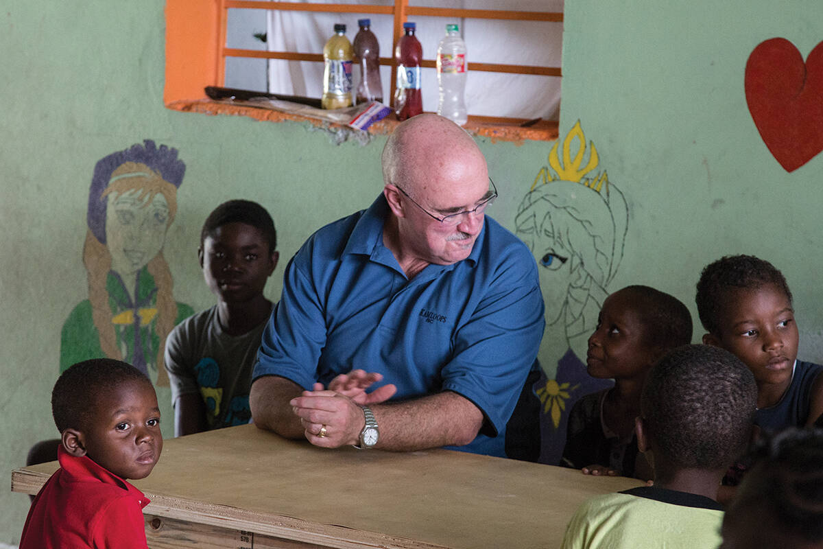 Bob Beckett waves to a child at the Divine Hands Orphanage near Port-au-Prince, Haiti. (Black Press Media file photo)