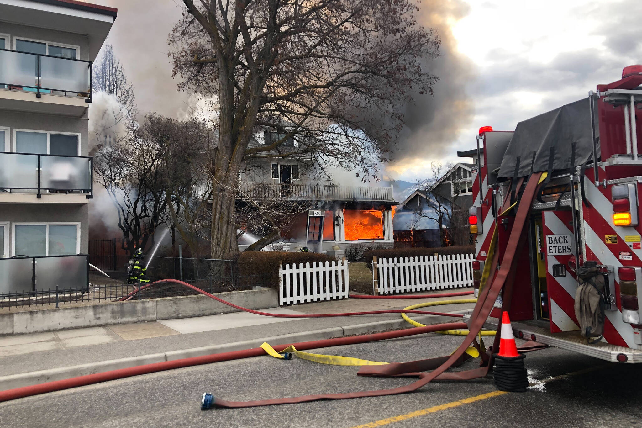 Firefighters in Penticton are at a fire on Lakeshore Drive. A house in the 400 block has exploded and the top floor has collapsed. (Monique Tamminga/Penticton Western)
 Firefighters in Penticton are at a fire on Lakeshore Drive. A house in the 400 block has exploded and the top floor has collapsed. (Monique Tamminga/Penticton Western)