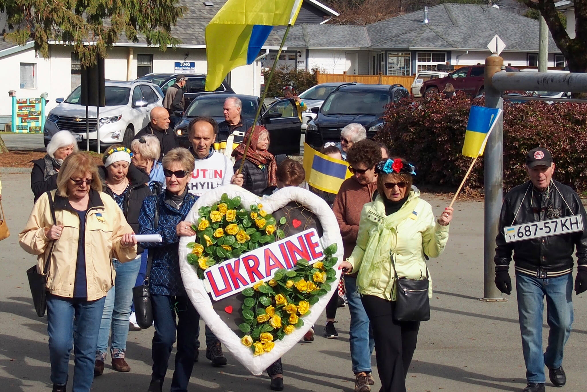 A group of Port Alberni residents marches from Blair Park to show support for Ukraine on March 4, 2022. (MIKE YOUDS / SPECIAL TO THE NEWS)