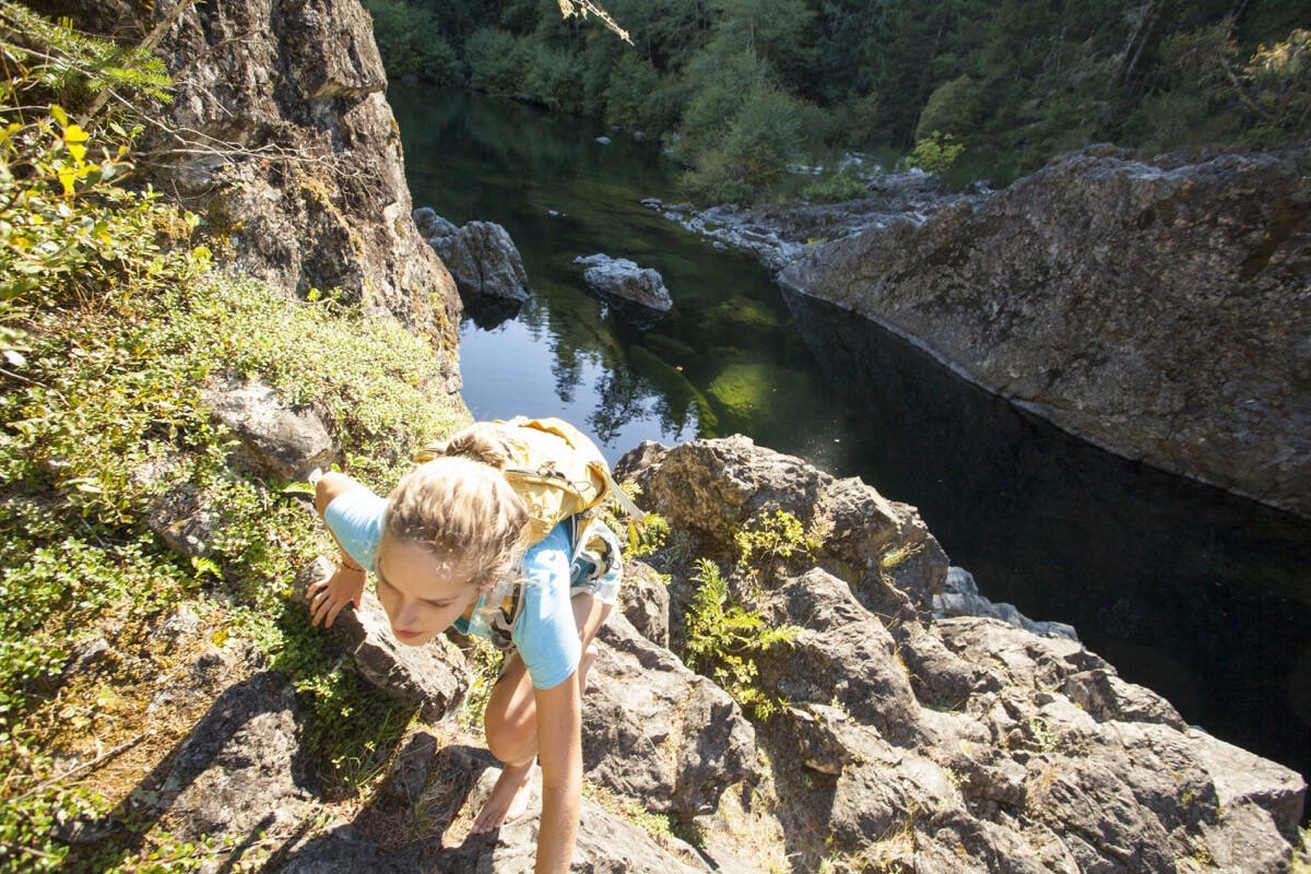 A climber scales a rock wall in the Sooke Potholes Regional Park, the management of which falls under the Regional Parks Strategic Plan. (Photo by TJ Watt)