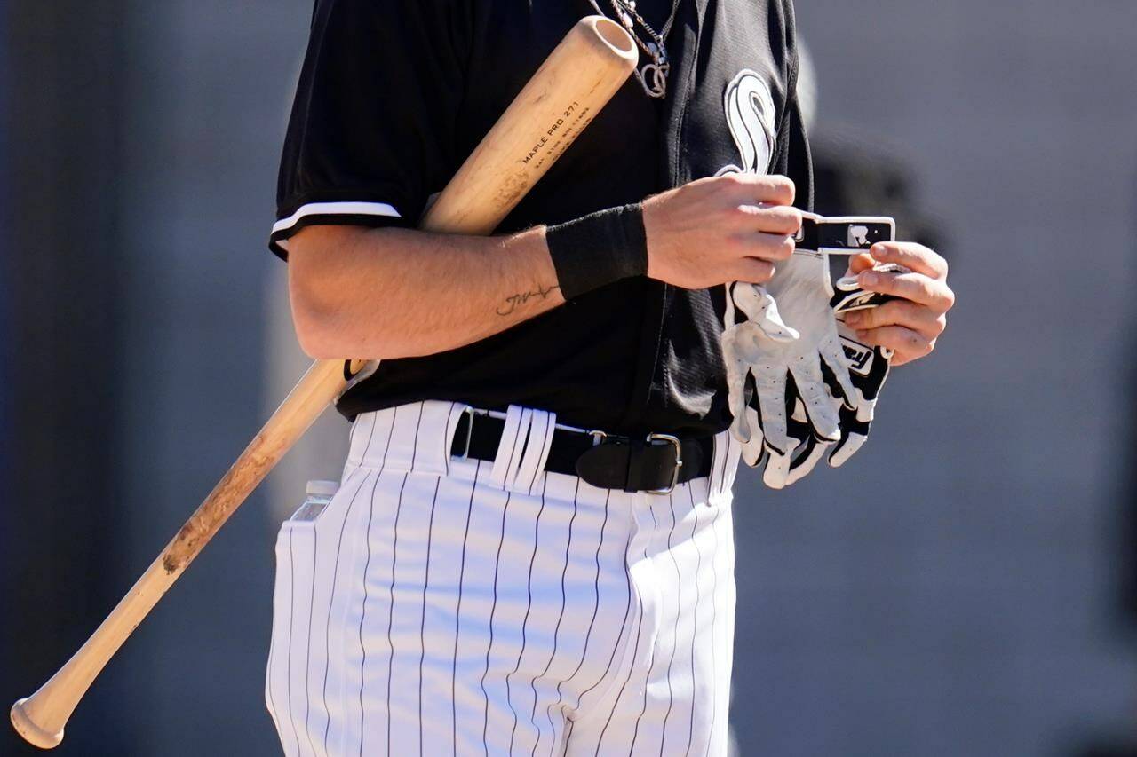 Chicago White Sox minor league outfielder Duke Ellis prepares for batting practice during a minor league baseball spring training workout Thursday, March 10, 2022, in Phoenix. (AP Photo/Ross D. Franklin)