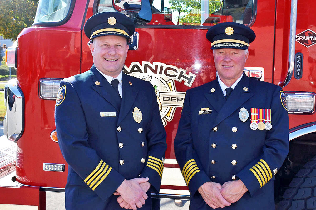 Then Saanich Fire Deputy Chief Frank Macdonald (left) and Chief Mike Burgess celebrate the chief’s retirement on Sept. 29, 2021. (File photo courtesy Mike Burgess)