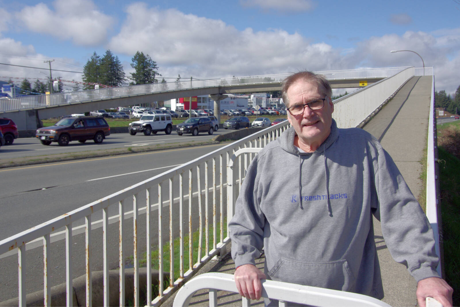 Rory MacIver, who lives near the pedestrian overpass that crosses the old Island Highway at Norwell Drive and Jingle Pot Road, says demonstrators are gathering on the bridge more frequently and inciting passing motorists to honk their horns. (Chris Bush/News Bulletin)
