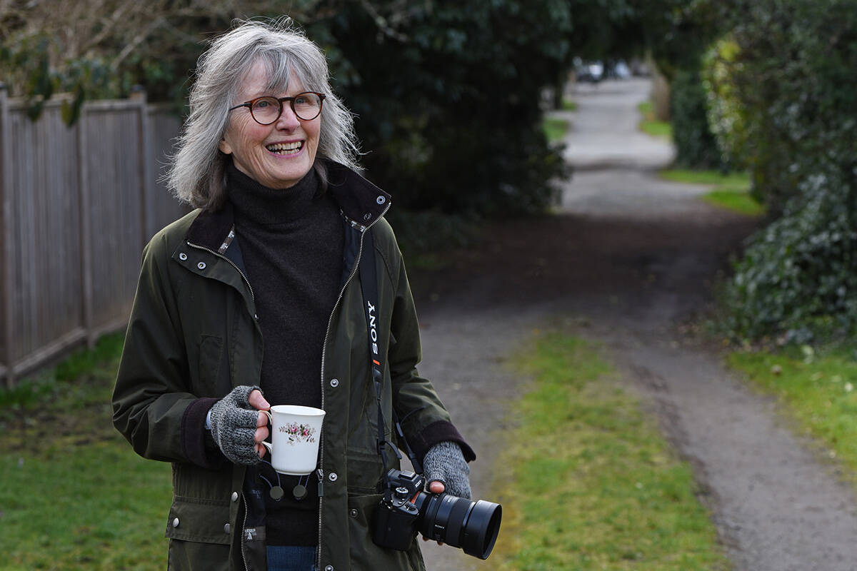 February 11, 2022 - Photographer Kate Seaborne holds a teacup in an Oak Bay back alley for a Tea With feature.  Don Denton photo