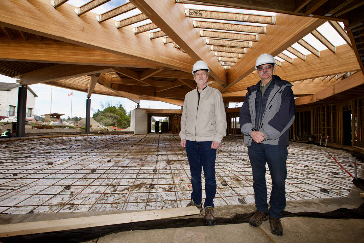 Jim Maxwell, president of the Victoria Highland Games Association and Ian Booth, president of the Victoria Scottish Community Centre Society stand inside the under-construction Craigflower Community and Performing Arts Centre on March 31. (Justin Samanski-Langille/News Staff)