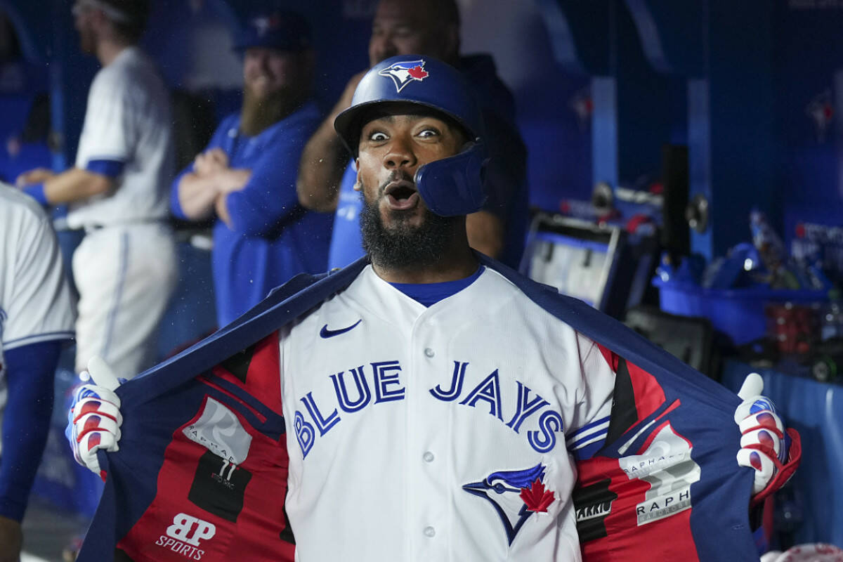 Toronto Blue Jays right fielder Teoscar Hernandez (37) reacts in the dugout after hitting a three run home run against the Texas Rangers during fifth inning home opener AL MLB baseball action in Toronto on Friday, April 8, 2022. THE CANADIAN PRESS/Nathan Denette