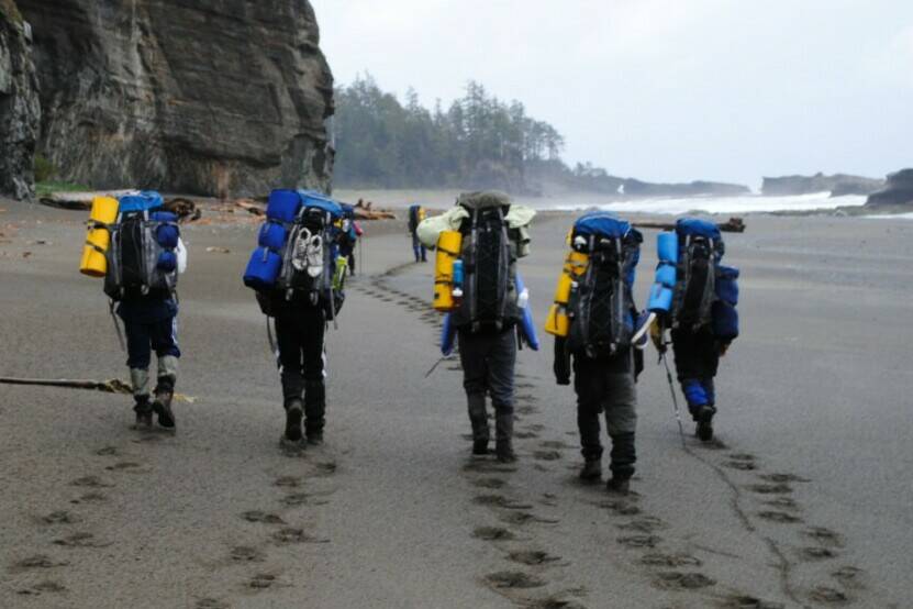 High school students participating in a Take A Hike event make their way along the beach during a multi-day camping trip. (Photo courtesy of Take A Hike)