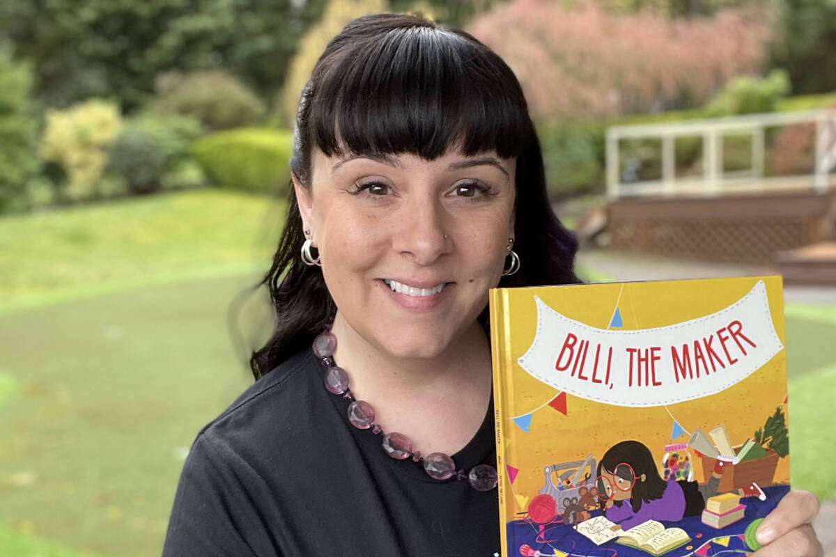 April Hilland poses with a copy of her new children’s book, Billi the Maker, inspired by past students. (Submitted photo)