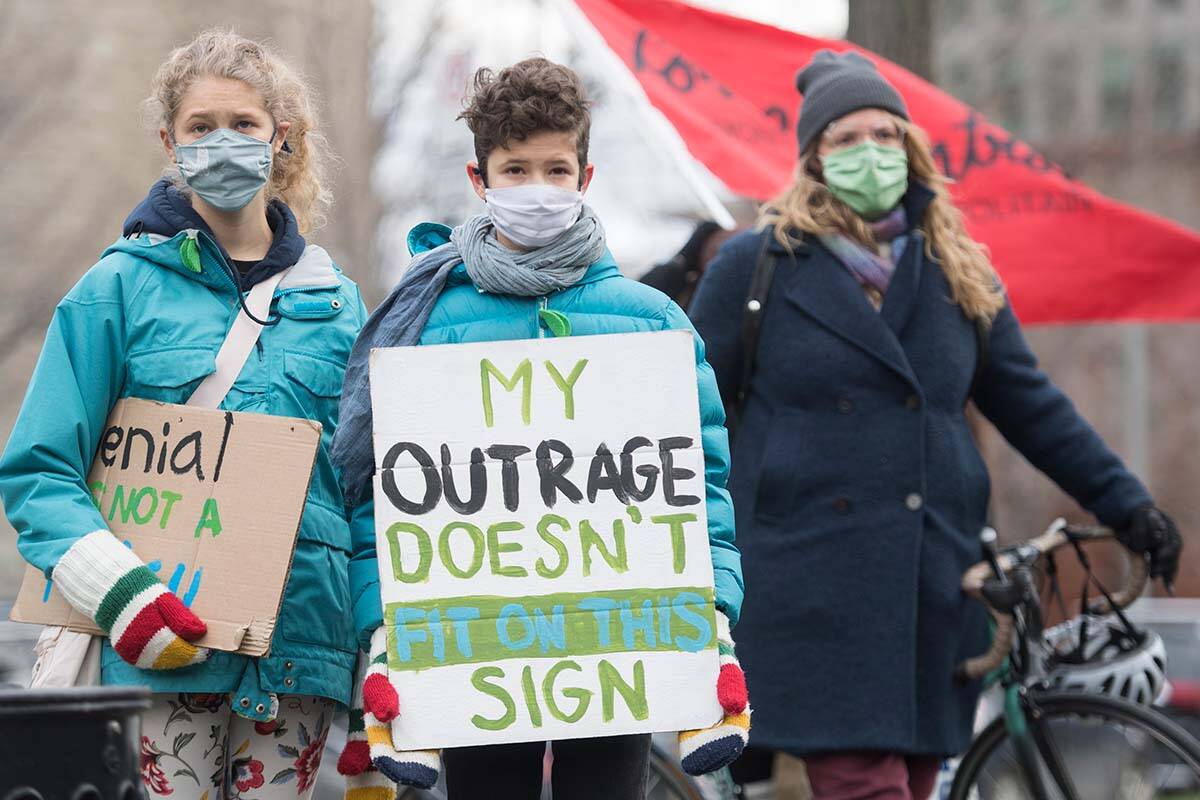 People take part in a climate change protest in Montreal, Nov. 21, 2020. A new project by a team of Simon Fraser University researchers aims to build a tool by monitoring social media that can determine Canadians’ climate distress in real time. THE CANADIAN PRESS/Graham Hughes