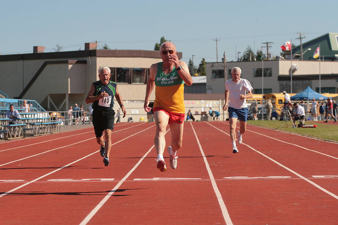 Runners reach the finish line during a track and field event at the B.C. Seniors Games in Nanaimo in 2007. (News Bulletin file photo)