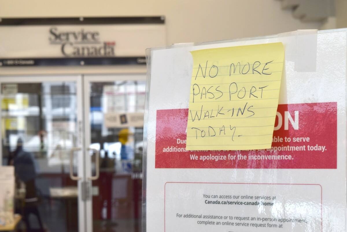 A notice posted April 26 alerts the public that no more walk-in clients will be taken for the day at the Service Canada Passport Services office in the The Bay Centre in Victoria. (Kiernan Green/News Staff)