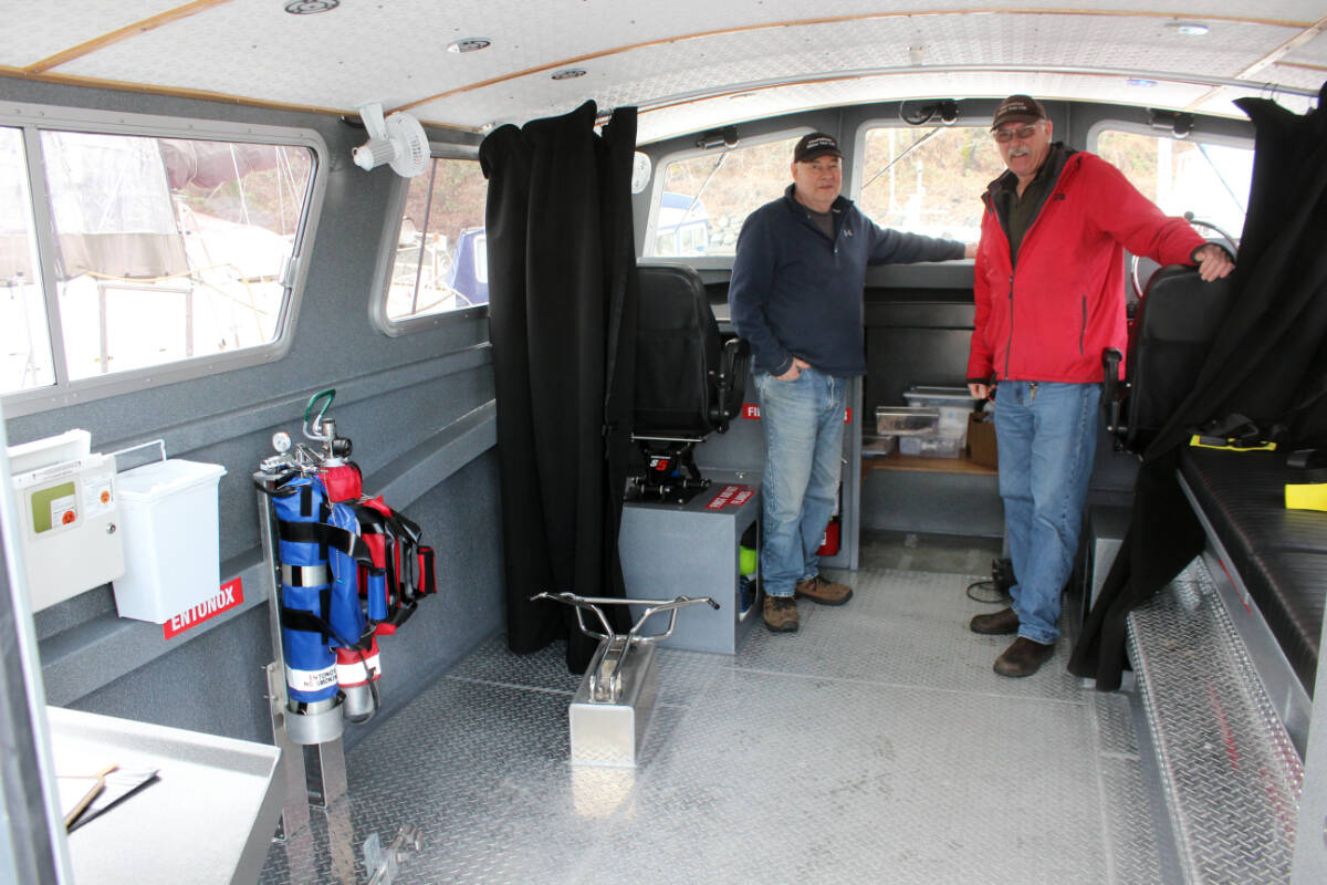 Brian Francoeur, left, and Harmen Bootsma inside the Island Responder. (Photo by Don Bodger)