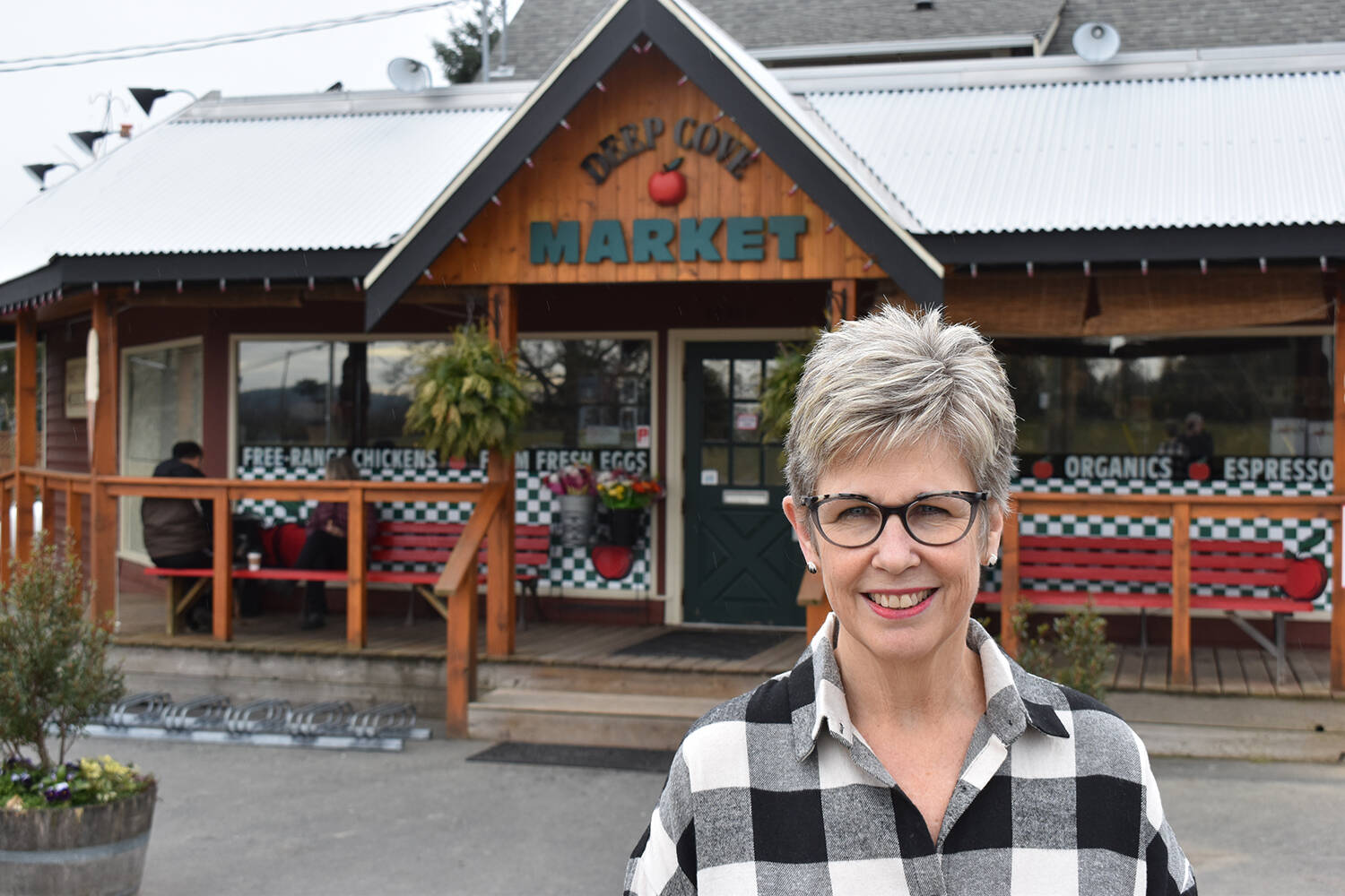 Rosemary Scott, owner of Deep Cove Market, here seen in 2020, continues to oppose measures to introduce parallel parking along the West Saanich frontage of her store. (Black Press Media file photo)