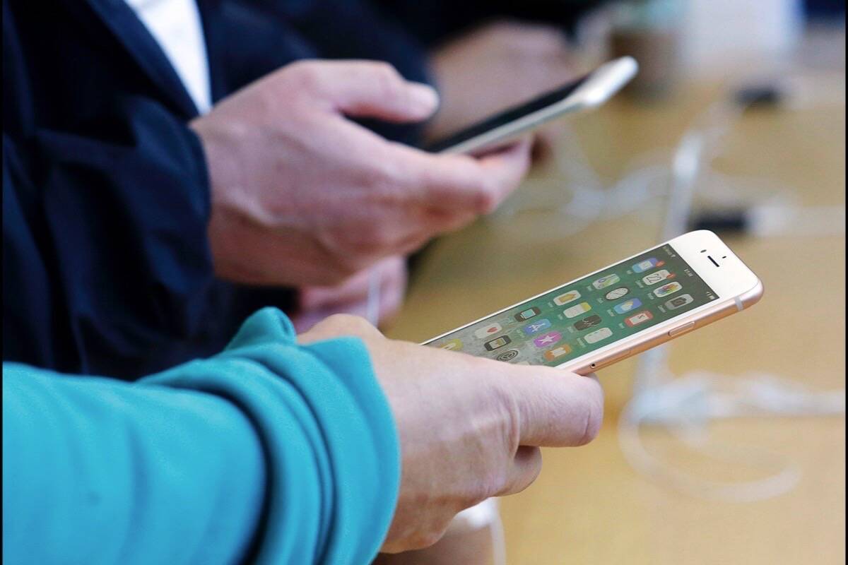 Smart phones allow billions of people around the world the opportunity to follow news and communications updates. (AP Photo/Jeff Chiu)