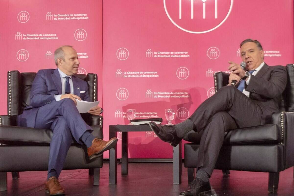 Coalition Avenir du Quebec leader Francois Legault, right, speaks to Chamber of Commerce President Michel Leblanc, in Montreal, Friday, Sept. 28, 2018. As Quebec’s contentious language law wends toward likely adoption this spring, the province’s business community is growing increasingly anxious about the impact on operations, from the bottom line to daily communication — or decamping entirely. THE CANADIAN PRESS/Ryan Remiorz