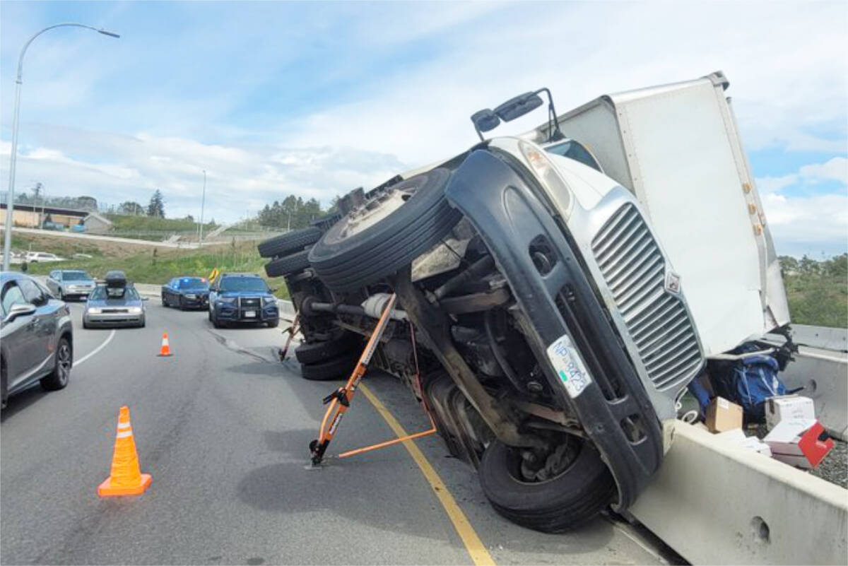 A moving truck that tipped over on the off-ramp from the Trans-Canada Highway onto Admirals Road was causing traffic slowdown. (Saanich Police Department/Twitter)