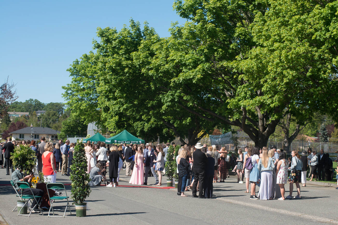 Gowns, suits and smiles filled a section of Henderson Road as Oak Bay High’s class of 2018 celebrated at the annual grad block party. (Black Press Media file photo)