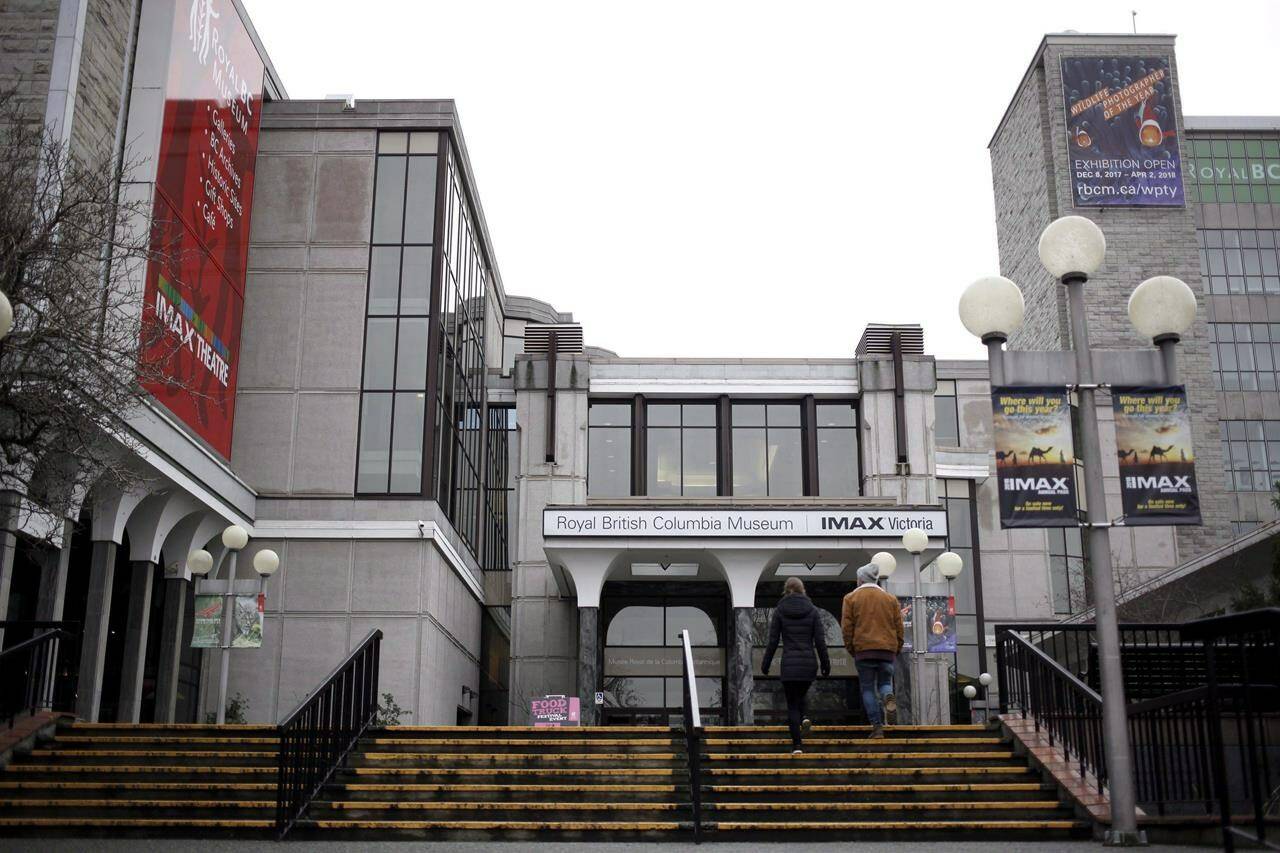 People walk up stairs to the entrance of the Royal BC Museum in Victoria, Thursday, Dec. 21, 2017. THE CANADIAN PRESS/Chad Hipolito