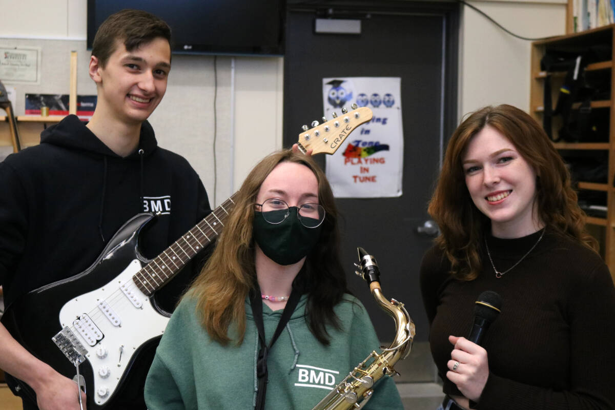Stavros Chrysoulis, Grade 12, Jay Lausman, Grade 11, Rachel Nordby, Grade 12 are preparing for the year-end concert at Belmont Secondary School. (Bailey Moreton/News Staff)