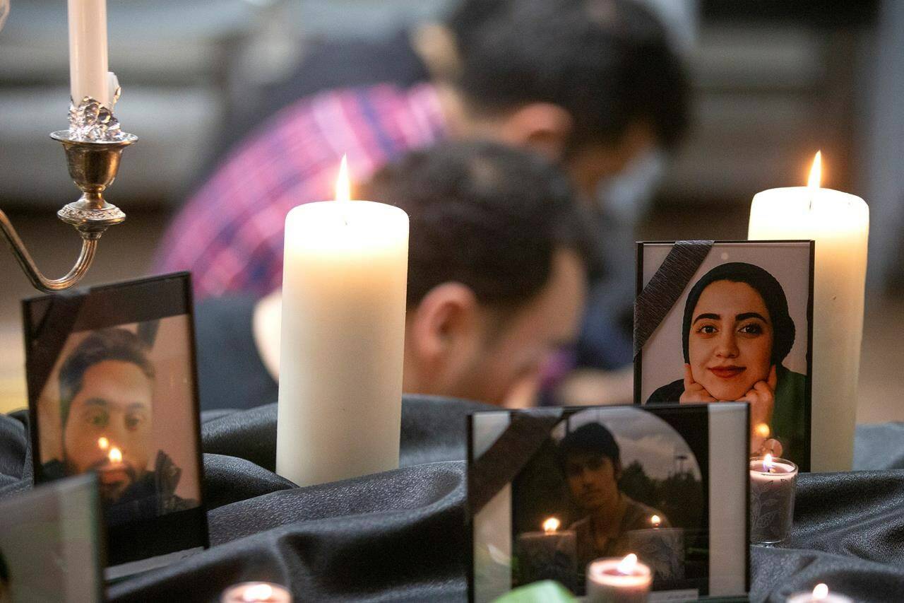 Photos of some of the victims stand among candles as members of Toronto’s Iranian community attend a vigil in Toronto on Wednesday, January 8, 2020, to mourn victims of Ukraine International Airlines Flight PS752 that crashed after takeoff near Tehran, Iran. Canada Soccer has cancelled a planned friendly with Iran in the face of growing criticism. At issue is whether Canada should be hosting Iran given the Canadians who died on Ukraine International Airlines Flight 752 when it was shot down on Jan. 8, 2020, minutes after taking off from Tehran, by an Iranian surface-to-air missile. THE CANADIAN PRESS/Chris Young