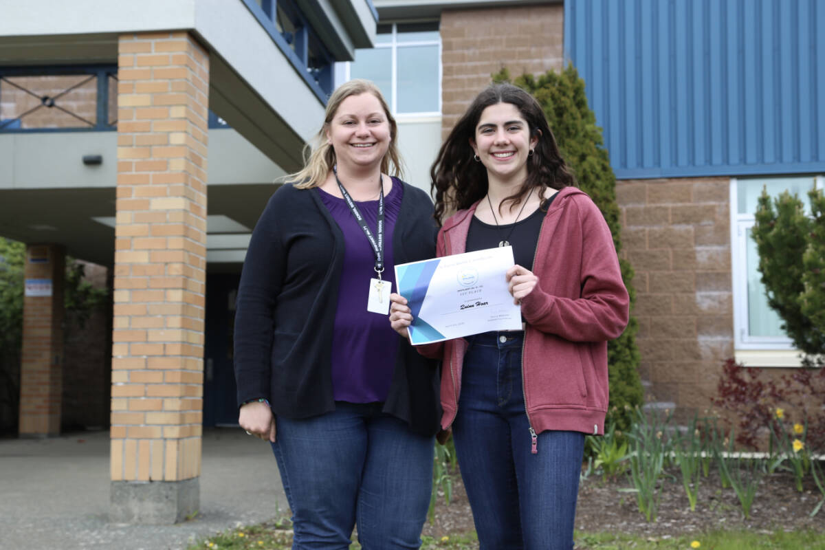 Isfeld student Quinn Hoar (right), with teacher Katelin Miller, celebrates her first-place provincial finish in a public speaking contest for deaf and hard-of-hearing students. Photo SD71