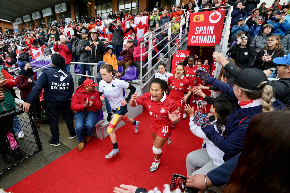 Players from Canada and Spain run onto the field during the HSBC World Rugby Sevens Series stop at Starlight Stadium in April. Rugby Canada is combining the women’s and men’s tournaments at BC Place Stadium in Vancouver starting in 2023. (Black Press Media file photo)