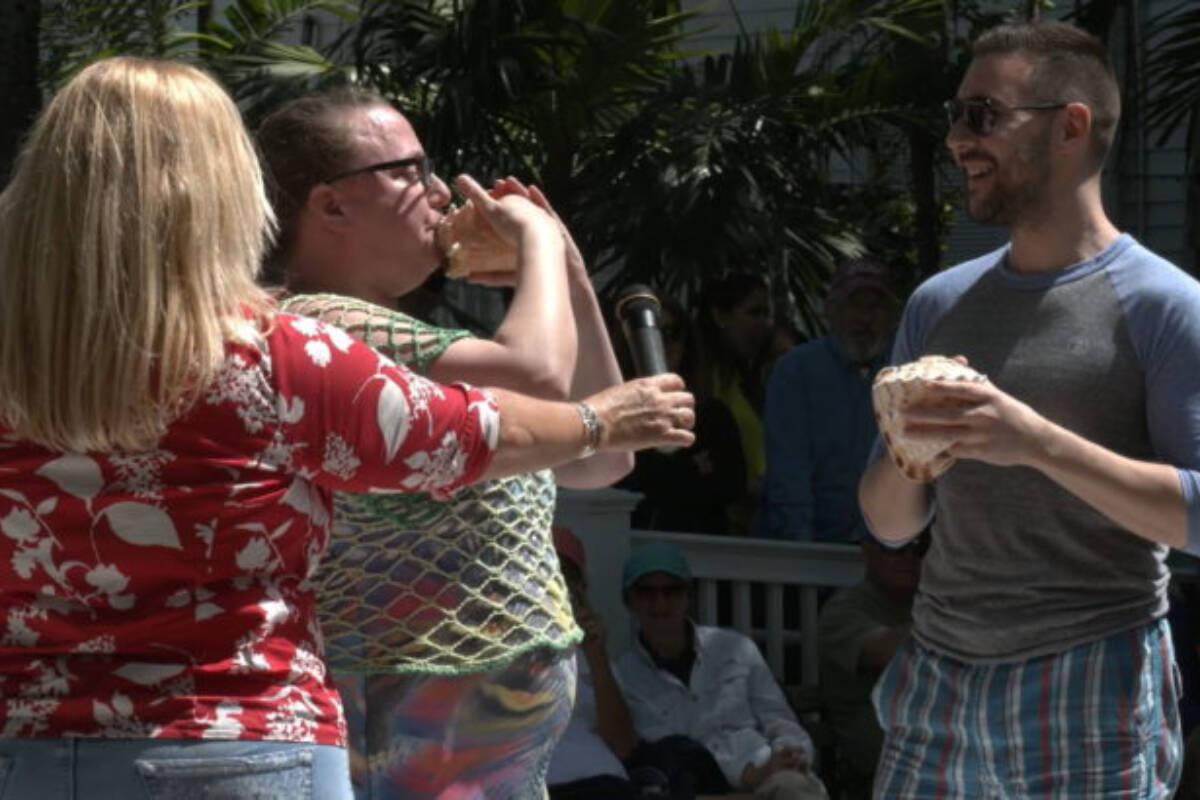 French horn musician and Royal Canadian Navy Naden Band member Alliszon Zaichkowski, centre, plays one of her 20 conch shells at a competition in Key West, Fla., during March 2020. Zaichkowski went on to win the contest’s women’s division and perform on Canada’s Got Talent. (Courtesy of Alliszon Zaichkowski)