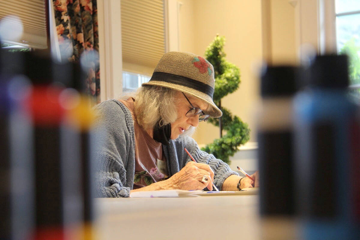 Grace Bartha works on her mandala at Carlton House in Oak Bay. (Christine van Reeuwyk/News Staff)