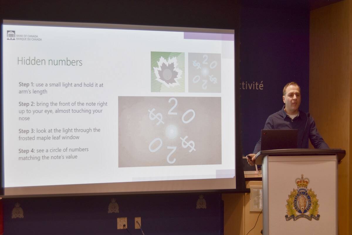 Bank of Canada analyst Farid Salji speaks to business owners about counterfeit bills at Kelowna RCMP headquarters. (Photo/Kelowna Cap News)
