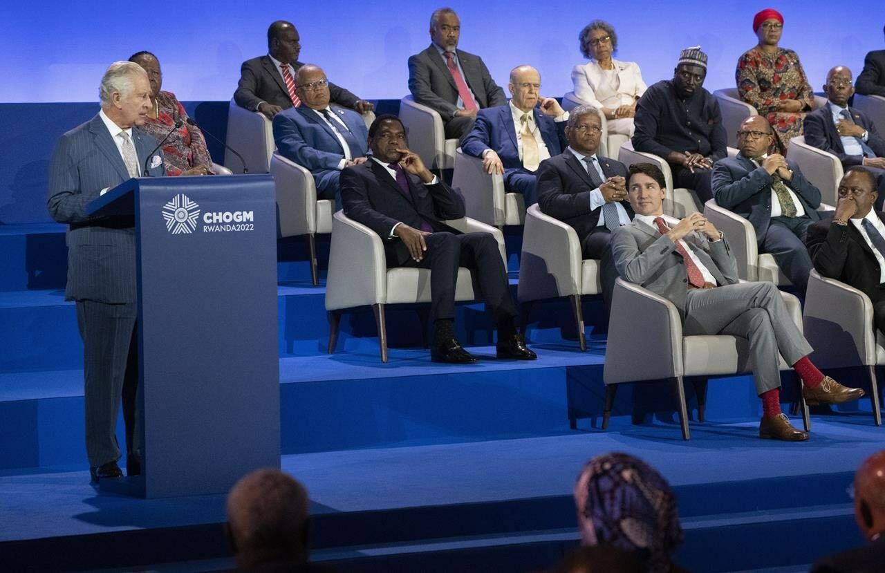 Prime Minister Justin Trudeau listens to Prince Charles delivering remarks during the opening ceremony of the Commonwealth Heads of Government Meeting in Kigali, Rwanda on Friday, June 24, 2022. THE CANADIAN PRESS/Paul Chiasson