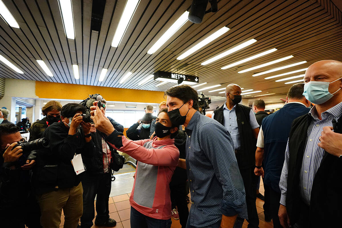 Prime Minister Justin Trudeau poses for a photo as he greets commuters at a Montreal Metro station on Tuesday, Sept. 21, 2021. When did Trudeau become leader of the Liberal Party of Canada? (THE CANADIAN PRESS/Sean Kilpatrick)