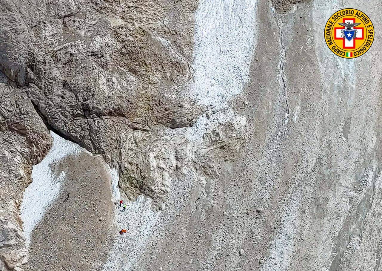 This image released on Sunday, July 3, 2022, by the Italian National Alpine and Cave Rescue Corps shows the rescue operations on the glacier in Italy’s Alps near Trento a large chunk of which has broken loose, killing at least six hikers and injuring eight others. Alpine rescue service officials, which provided that toll Sunday evening, said it could take hours to determine if any hikers might be missing. The National Alpine and Cave Rescue Corps tweeted that the search of the involved area of Marmolada peak involved at least five helicopters and rescue dogs. (Corpo Nazionale Soccorso Alpino e Speleologico via AP)