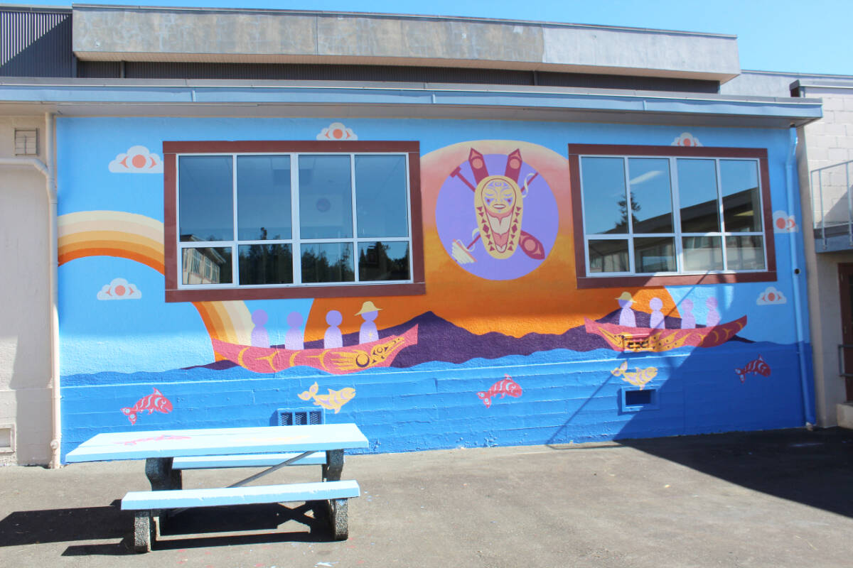 The finished Indigenous mural project of art students, with expertise from Charlene Johnny, greatly enhances the courtyard of Chemainus Secondary School. (Photo by Don Bodger)