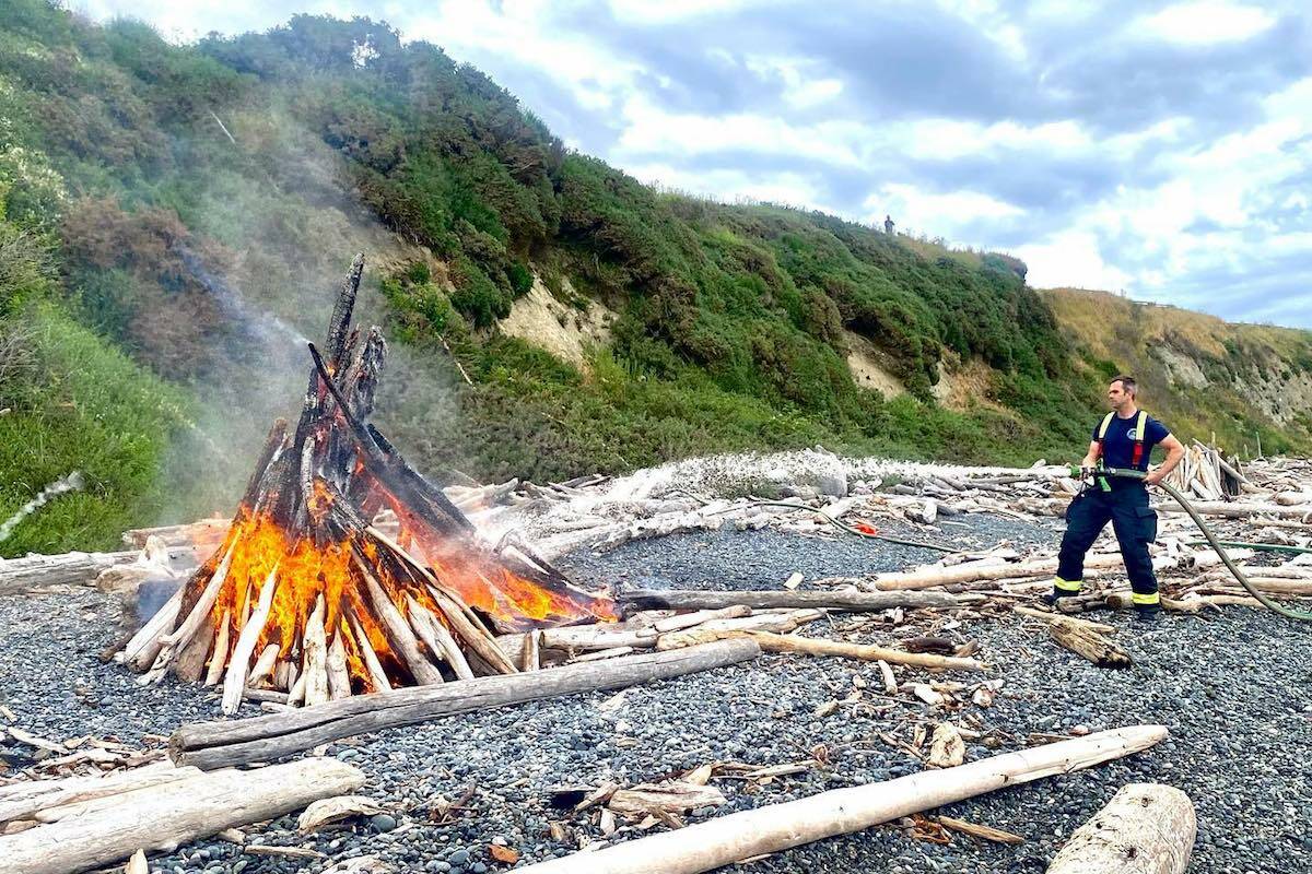 A fire at the Dallas Road beach in late June was extinguished by fire crews. (Courtesy of the Victoria Fire Department)