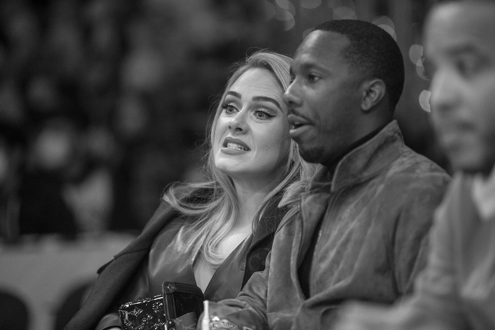 FILE – Singer Adele and sports agent Rich Paul attend a game between the Golden State Warriors and the Los Angeles Lakers on Oct. 19, 2021, at STAPLES Center in Los Angeles. Allen J. Schaben (Los Angeles Times/AP)